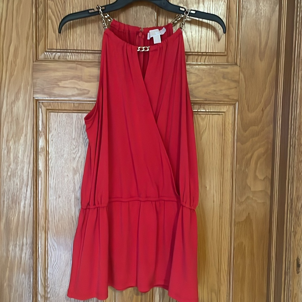 Red sleeveless top
